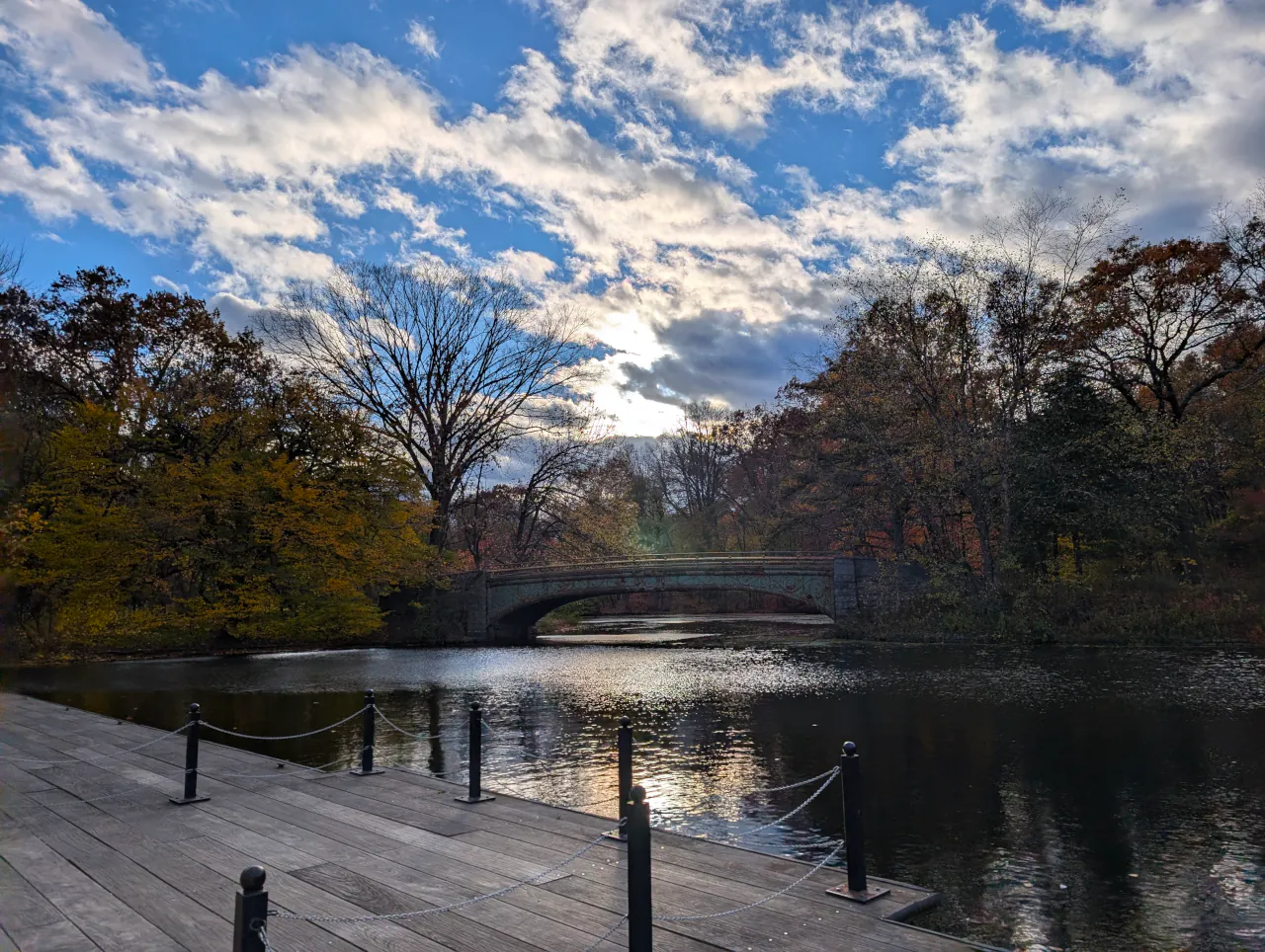 Bridge over a lake with sun